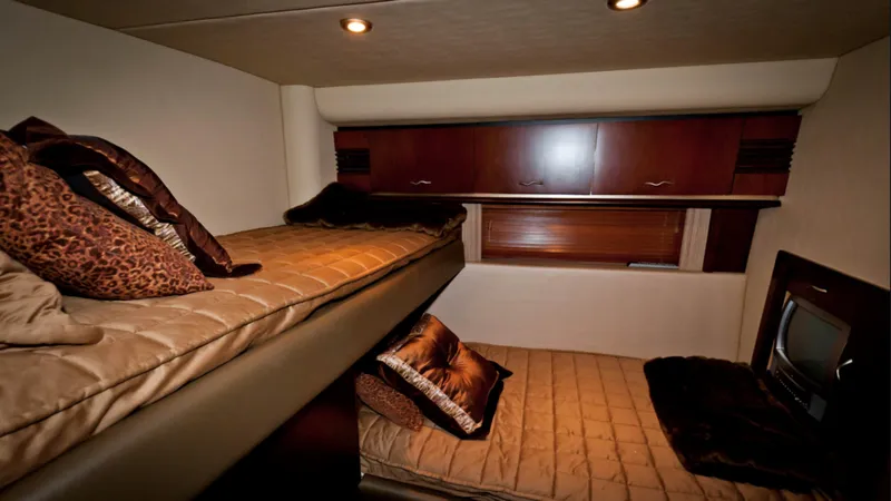 Slide: The Image of Interior cabin of 2006 Sea Ray 58 Sedan Bridge with bunk beds and luxurious decor. - 8