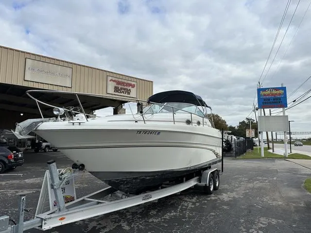 Slide: The Image of 1999 Sea Ray 270 Sundancer on trailer outside dealership. - 3