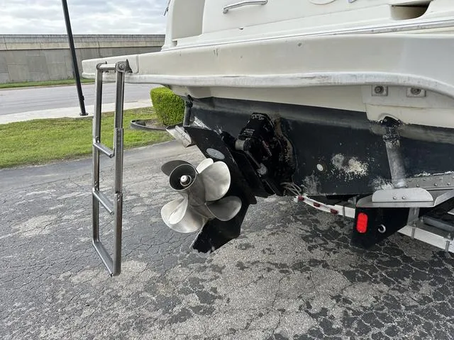 Slide: The Image of 1999 Sea Ray 270 Sundancer boat stern with propeller and swim ladder. - 7