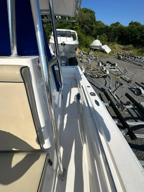 Slide: The Image of 2013 Contender 28 Tournament boat docked with trailers in the background. - 13