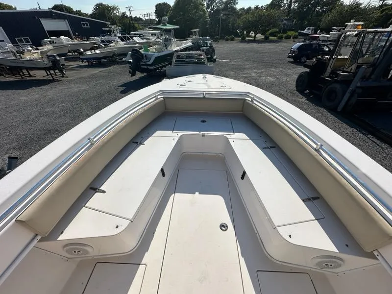 Slide: The Image of 2013 Contender 28 Tournament boat bow view at a marina. - 16