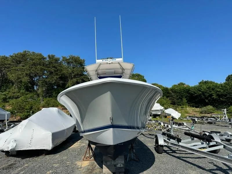 Slide: The Image of 2013 Contender 28 Tournament boat on dry dock, front view. - 2