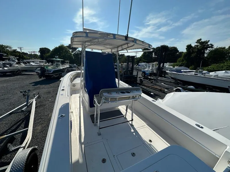 Slide: The Image of 2013 Contender 28 Tournament boat docked at a marina under clear skies. - 4