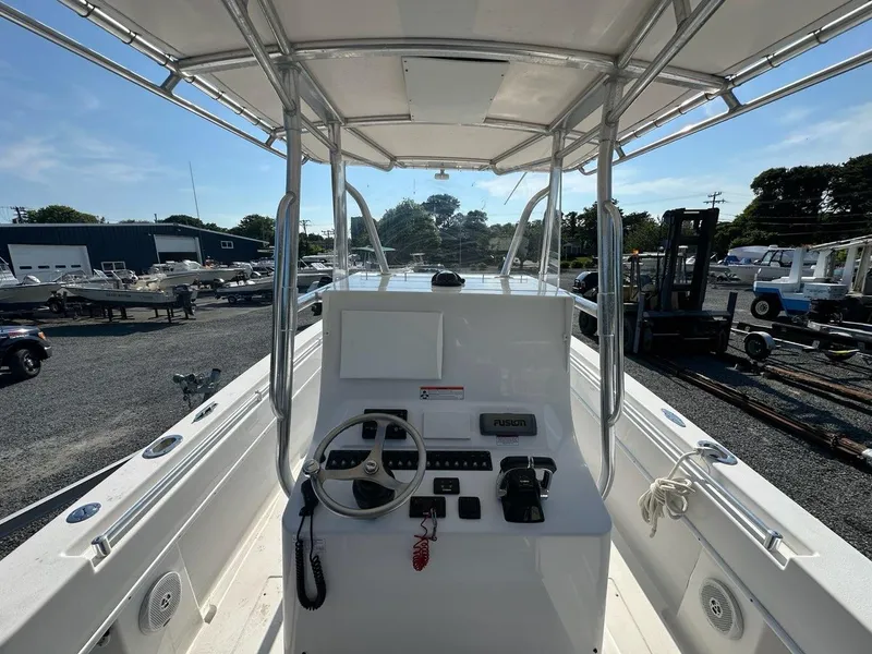 Slide: The Image of 2013 Contender 28 Tournament boat console with steering wheel and electronics. - 7