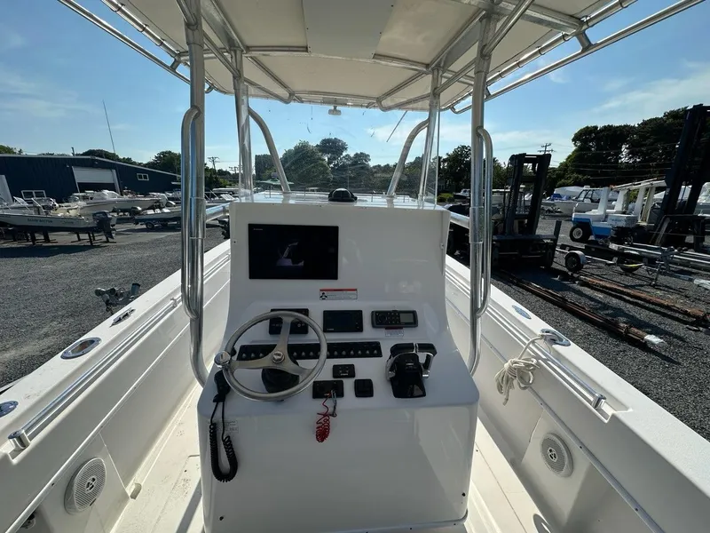 Slide: The Image of 2013 Contender 28 Tournament boat console with steering wheel and navigation equipment. - 8