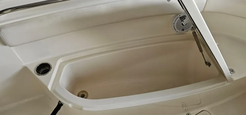Slide: The Image of 2014 Pursuit C 260 Center Console storage compartment. - 36
