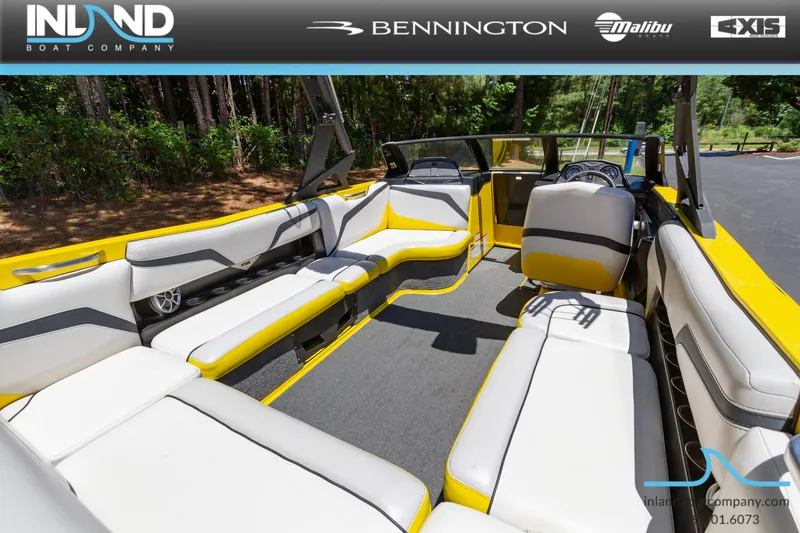 Slide: The Image of 2016 Axis T23 boat interior with yellow and white seating, displayed by Inland Boat Company. - 11