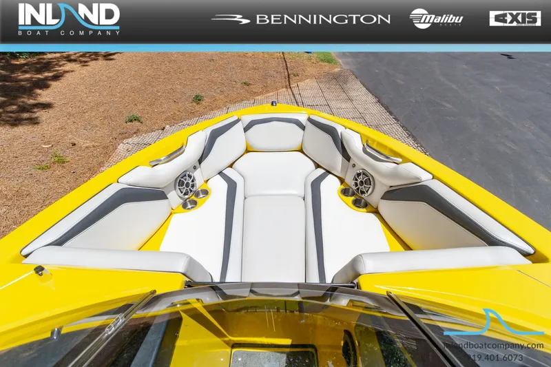 Slide: The Image of 2016 Axis T23 boat with yellow exterior and white interior seating. - 14