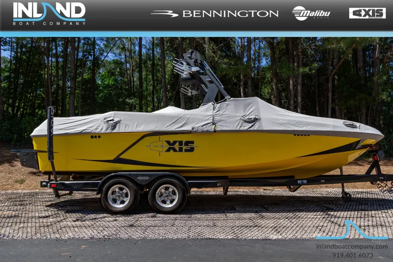 Slide: The Image of 2016 Axis T23 yellow boat on trailer with cover, displayed by Inland Boat Company. - 22
