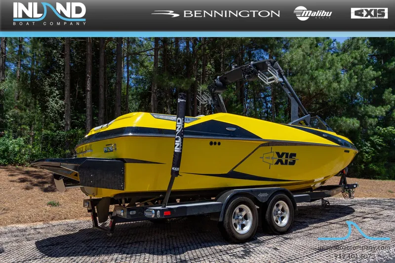 Slide: The Image of 2016 Axis T23 yellow boat on trailer at Inland Boat Company. - 4