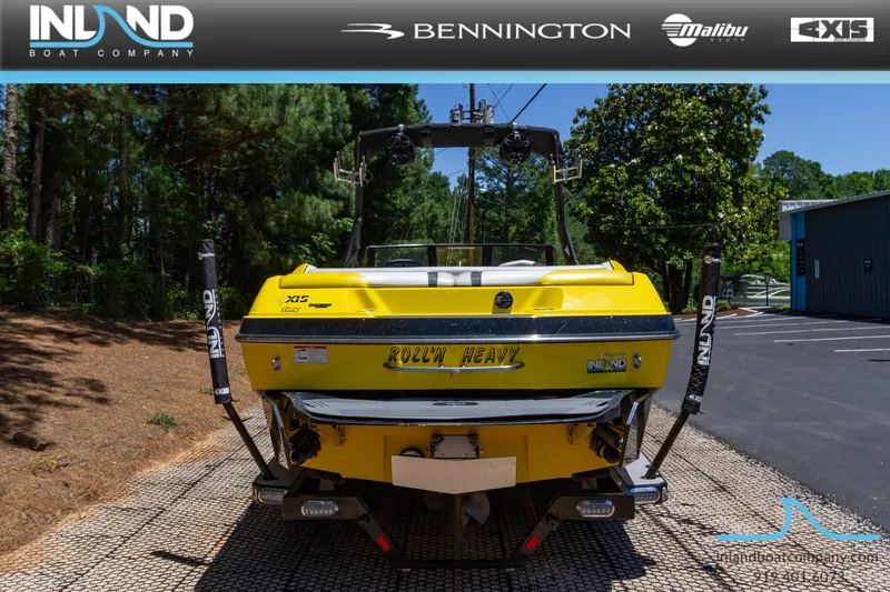 Slide: The Image of 2016 Axis T23 yellow boat at Inland Boat Company dealership. - 5