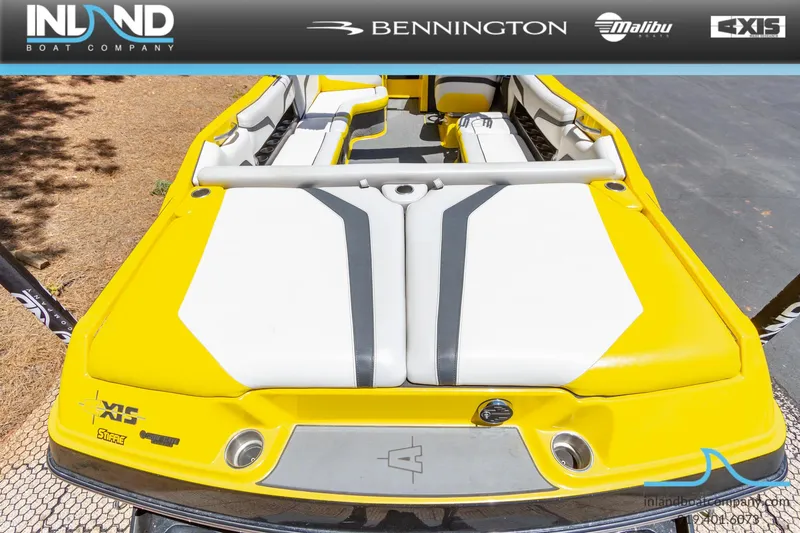 Slide: The Image of 2016 Axis T23 boat with yellow and white seating, displayed by Inland Boat Company. - 7