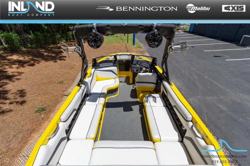 Slide: The Image of 2016 Axis T23 boat interior with yellow and white seating, Inland Boat Company. - 9