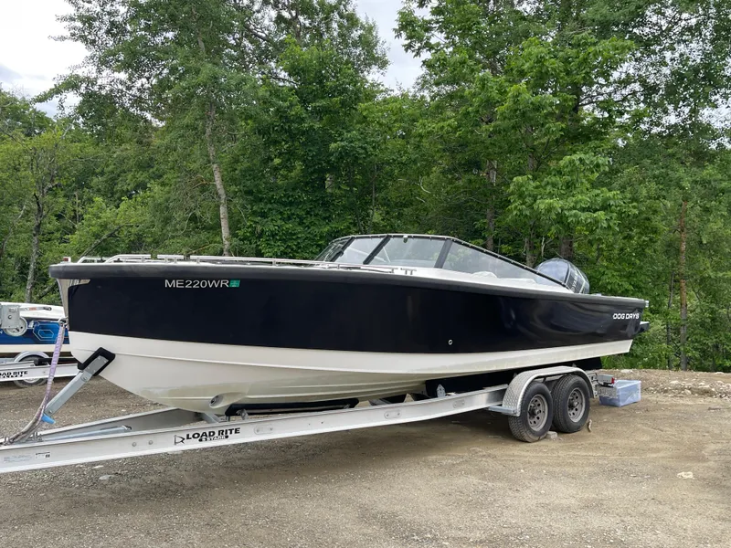 Slide: The Image of 2016 Draco 27 RS boat on Load Rite trailer in wooded area. - 11