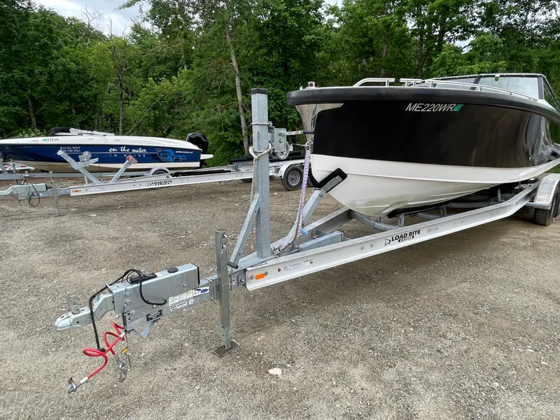 Slide: The Image of 2016 Draco 27 RS boat on trailer in outdoor storage area. - 12