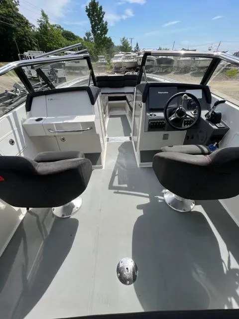 Slide: The Image of 2016 Draco 27 RS boat interior with dual seats and steering console. - 15