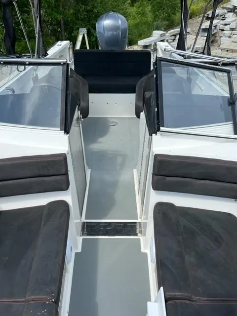 Slide: The Image of 2016 Draco 27 RS boat interior with seating and windshield. - 25