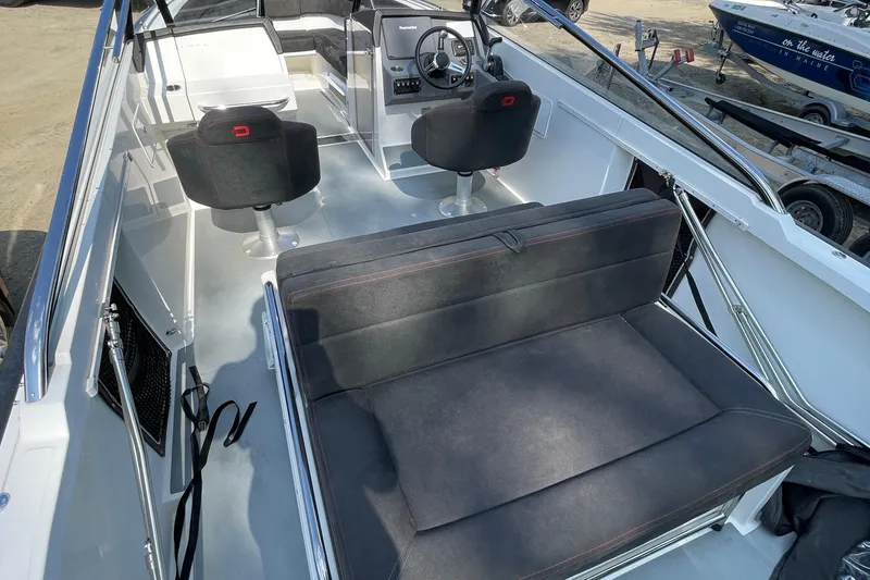 Slide: The Image of Interior of 2016 Draco 27 RS boat with seating and steering console. - 32
