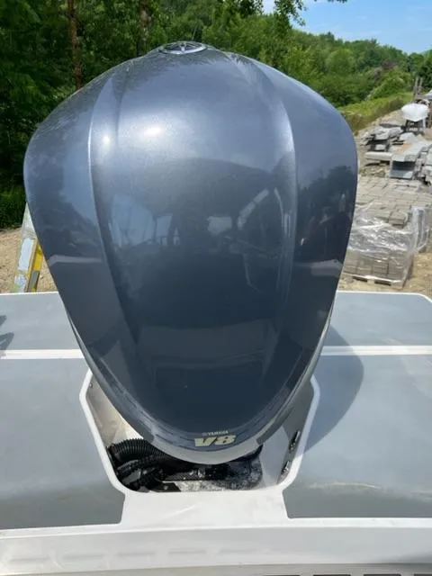 Slide: The Image of 2016 Draco 27 RS V8 outboard motor in a scenic outdoor setting. - 33