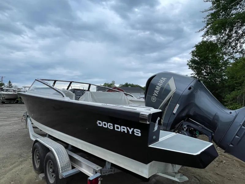 Slide: The Image of 2016 Draco 27 RS boat named Dog Days on a trailer with Yamaha outboard motor. - 5