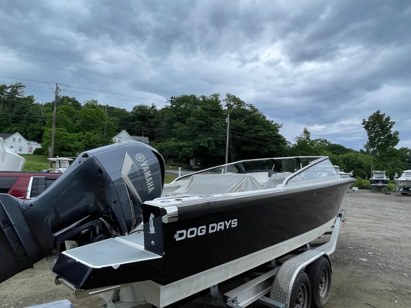 Slide: The Image of 2016 Draco 27 RS boat named Dog Days on a trailer with Yamaha outboard motor. - 6