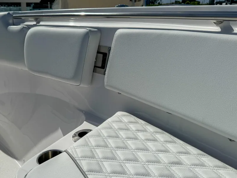 Slide: The Image of 2025 Sea Fox 328 Commander boat interior with cushioned seating and cup holders. - 23