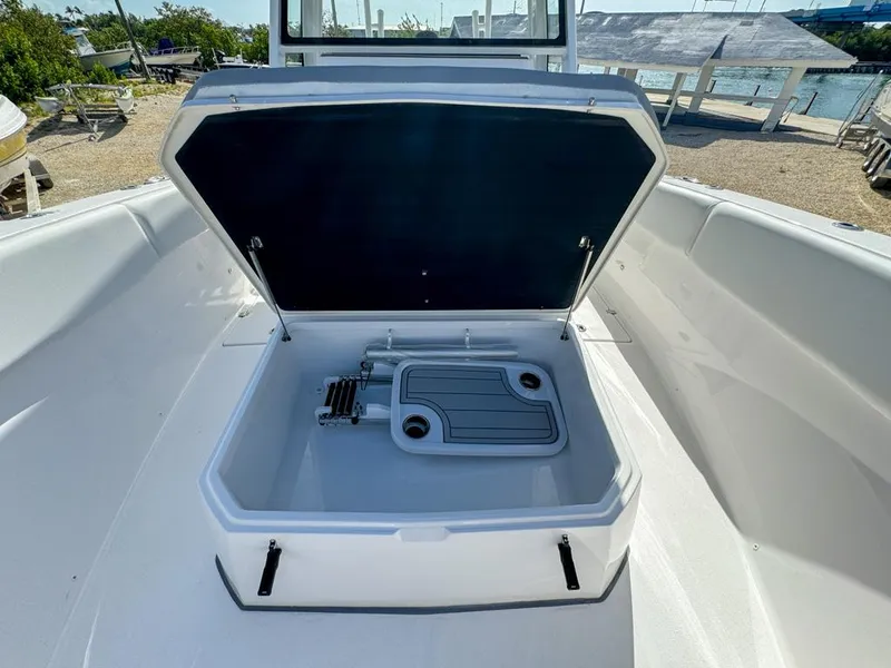 Slide: The Image of 2025 Sea Fox 328 Commander boat storage compartment open, showcasing interior features. - 24