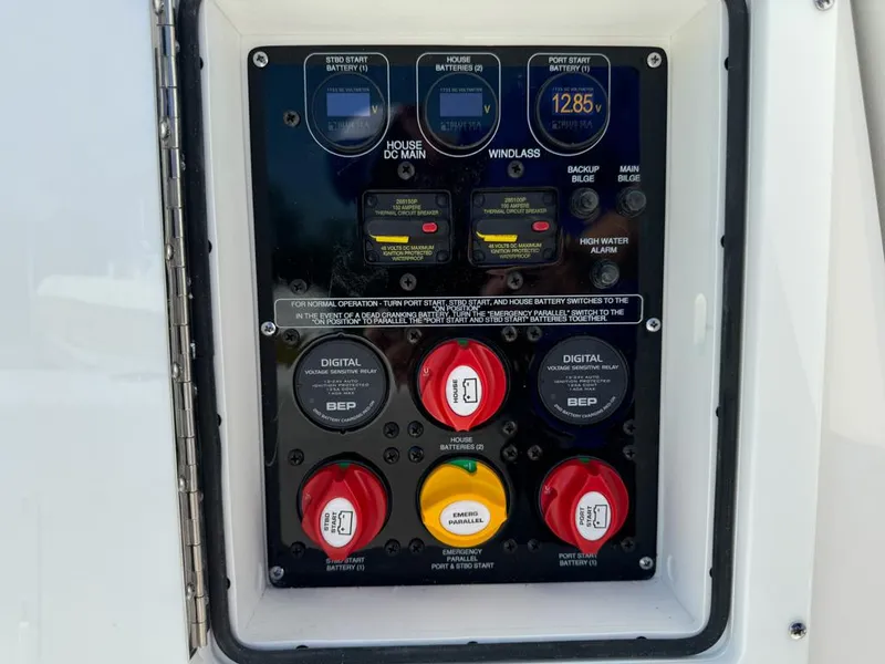 Slide: The Image of Control panel of a 2025 Sea Fox 328 Commander boat with various switches and indicators. - 28