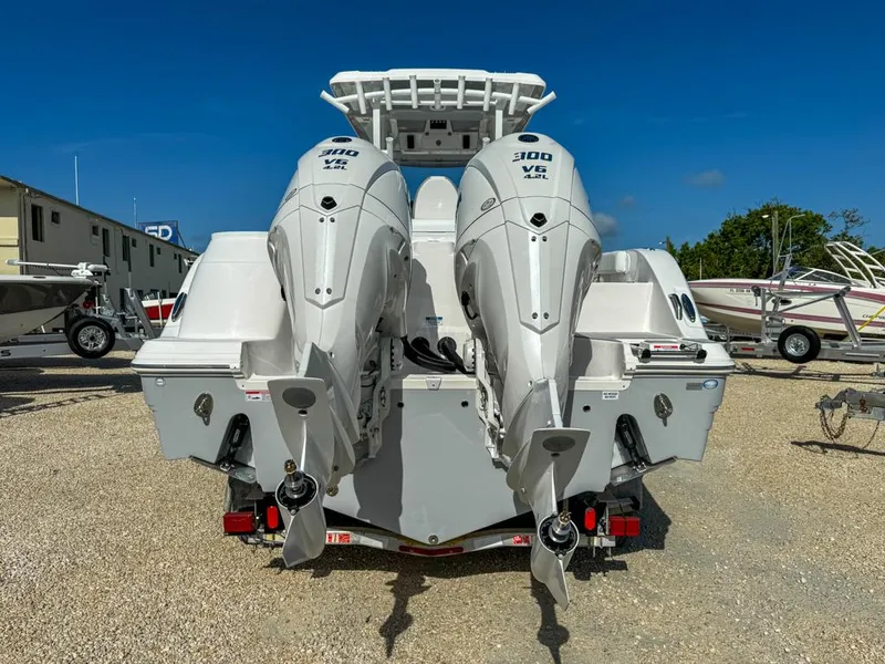 Slide: The Image of 2025 Sea Fox 328 Commander boat on trailer, featuring dual outboard engines. - 3