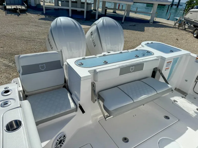 Slide: The Image of 2025 Sea Fox 328 Commander boat interior with seating and twin Yamaha engines. - 8