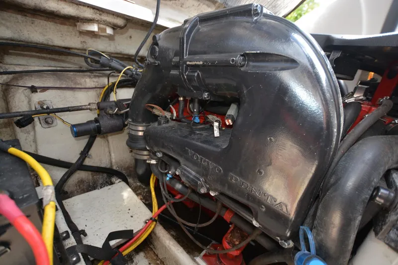 Slide: The Image of 2012 Four Winns F244 boat engine compartment with Volvo Penta engine. - 19