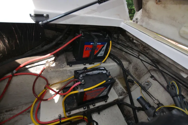 Slide: The Image of 2012 Four Winns F244 boat battery compartment with wiring. - 20