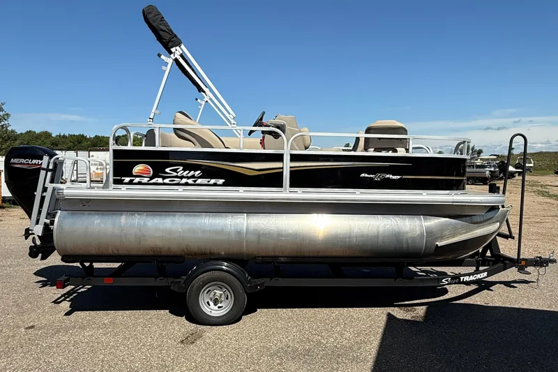 Slide: The Image of 2022 Sun Tracker Bass Buggy 16 XL Select pontoon boat on trailer, sunny day. - 5