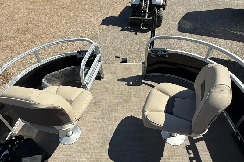 Slide: The Image of 2022 Sun Tracker Bass Buggy 16 XL Select pontoon boat with two beige seats. - 9
