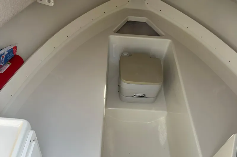 Slide: The Image of 2004 Hydra-Sports 230 WA boat cabin interior with portable toilet. - 5