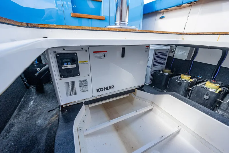 Slide: The Image of Engine compartment of a 2021 Gulf Crosser 52 boat with Kohler generator. - 18