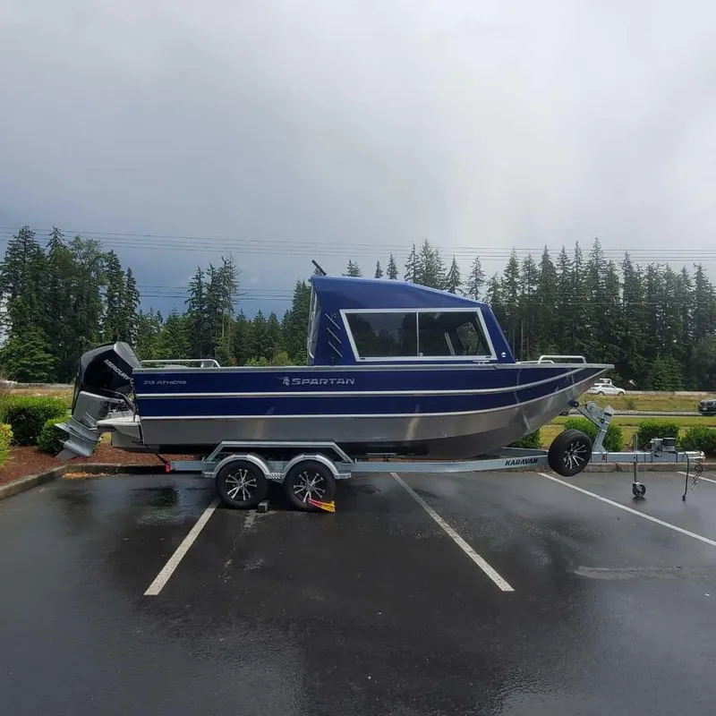 The Image of 2024 Spartan 215 Athens boat on trailer in parking lot. - 0