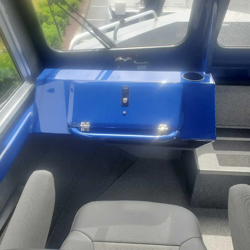 Slide: The Image of Interior of 2024 Spartan 215 Athens boat with blue dashboard and seating. - 16