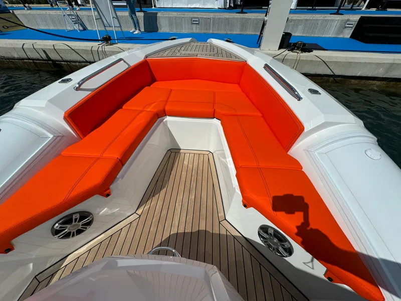 Slide: The Image of SuperRib Open 27 (2025) boat with orange seating and wooden deck. - 28