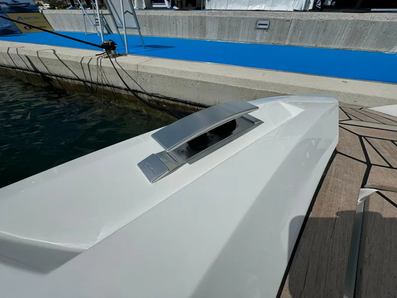 Slide: The Image of 2025 SuperRib Open 27 boat docked, showcasing sleek design and modern cleat. - 31
