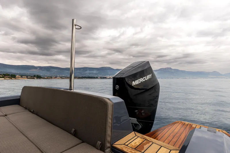 Slide: The Image of SuperRib Open 27 boat with Mercury engine on a cloudy day, 2026 model. - 4