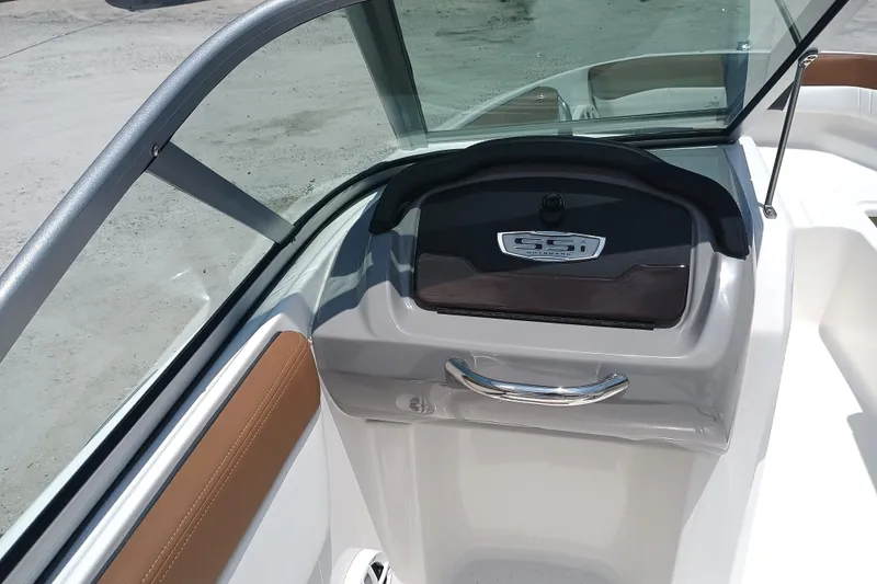 Slide: The Image of 2024 Chaparral 19 SSi OB boat interior with sleek dashboard and windshield. - 14