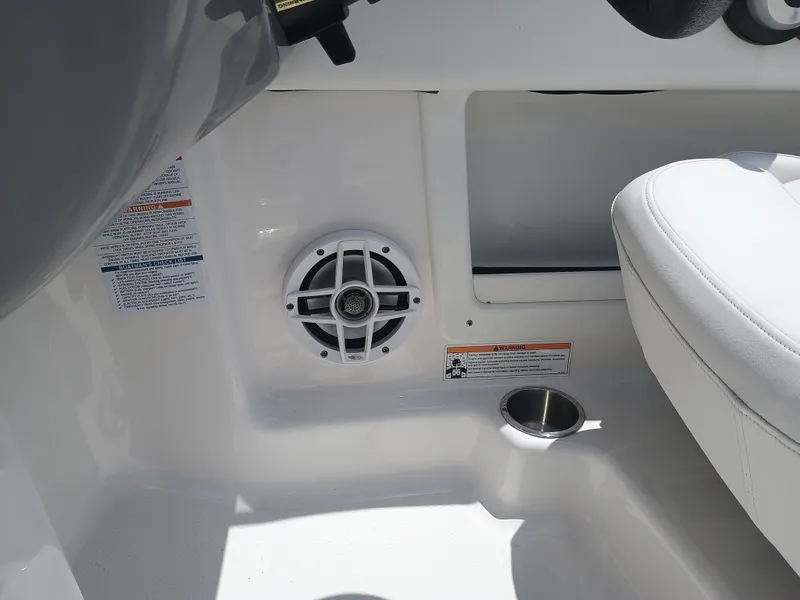 Slide: The Image of 2024 Chaparral 19 SSi OB interior with speaker and cup holder detail. - 16