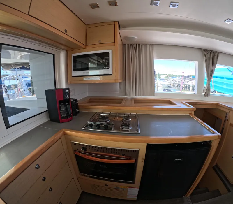 Slide: The Image of Modern kitchen interior of 2014 Lagoon 450 yacht with appliances and window view. - 11
