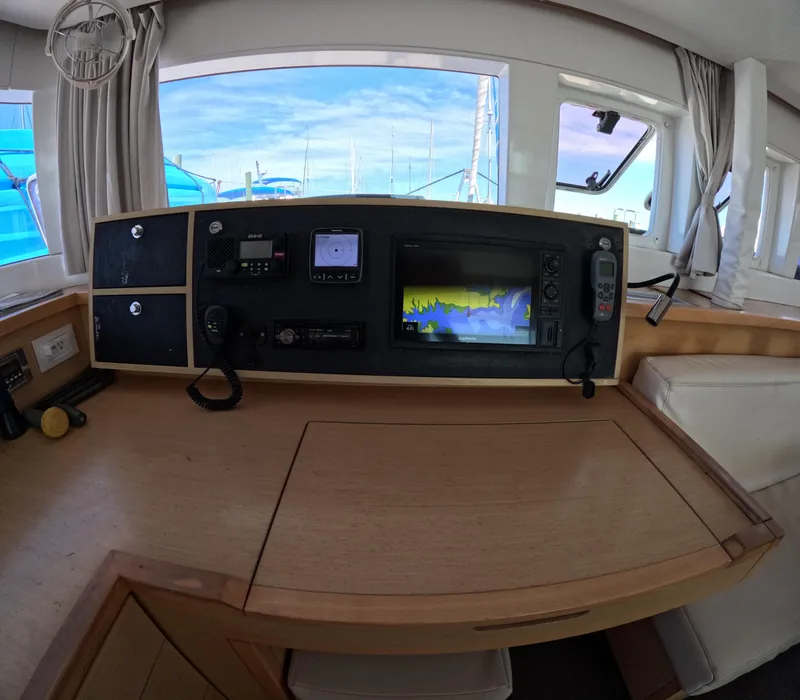 Slide: The Image of Interior helm station of a 2014 Lagoon 450 catamaran with navigation equipment. - 16