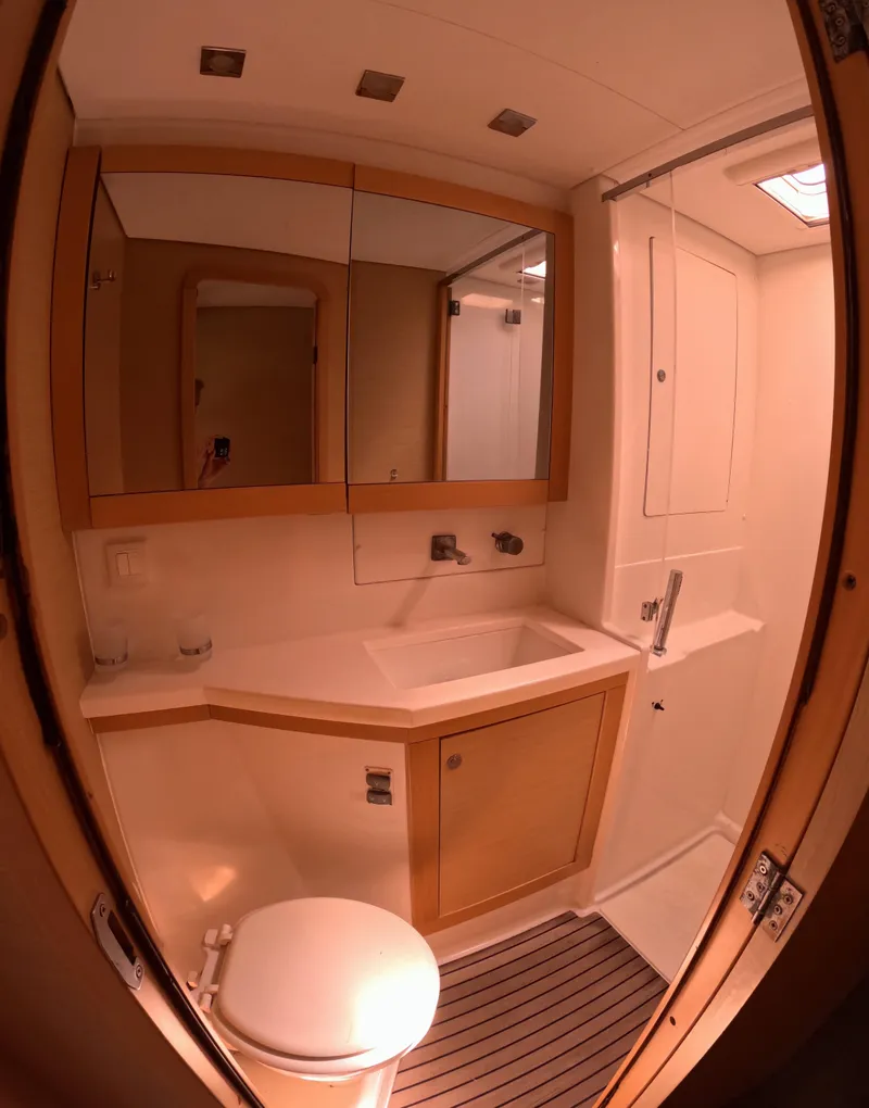 Slide: The Image of Bathroom interior of 2014 Lagoon 450 yacht with modern fixtures and wooden accents. - 27