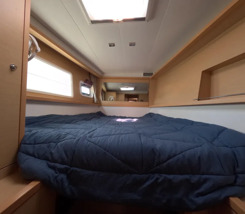 Slide: The Image of Interior cabin of 2014 Lagoon 450 yacht with cozy bed and natural light. - 33
