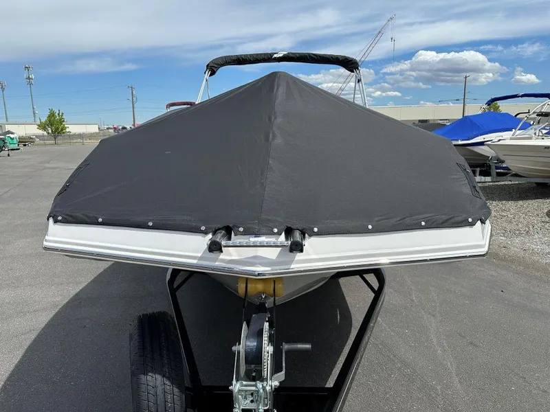 Slide: The Image of 2024 Starcraft SVX 211 OB boat with black cover on trailer. - 1