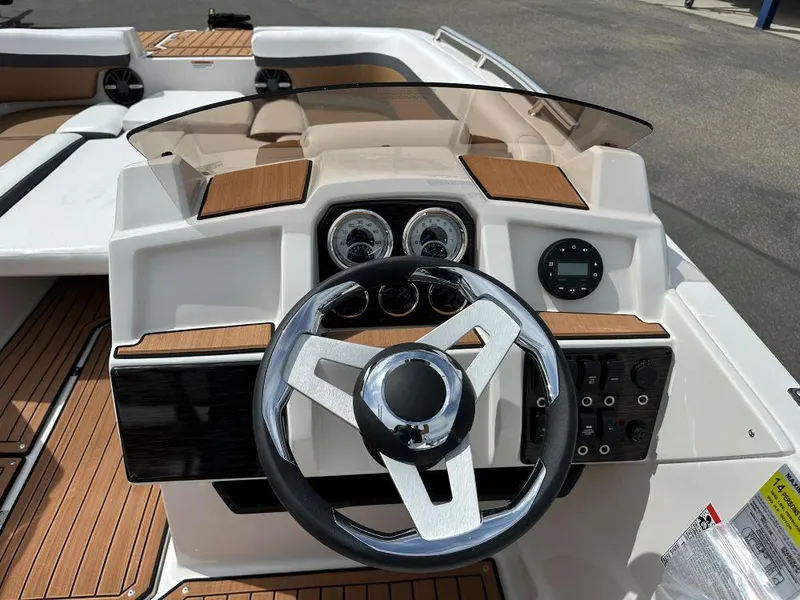 Slide: The Image of 2024 Starcraft SVX 211 OB boat dashboard with steering wheel and instrument panel. - 7