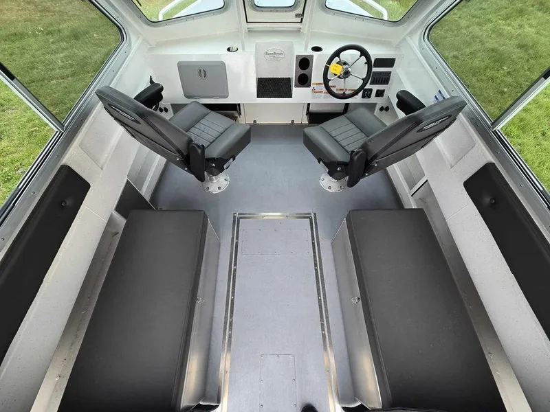 Slide: The Image of Interior of 2024 Silver Streak RENFREW boat with seating and steering wheel. - 3